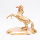 nickel silver finish flying horse with a sturdy base