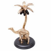 Desert safari walking camel under a coconut tree handcrafted piece of art