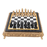 Chess game with marble finish on top and gold frame